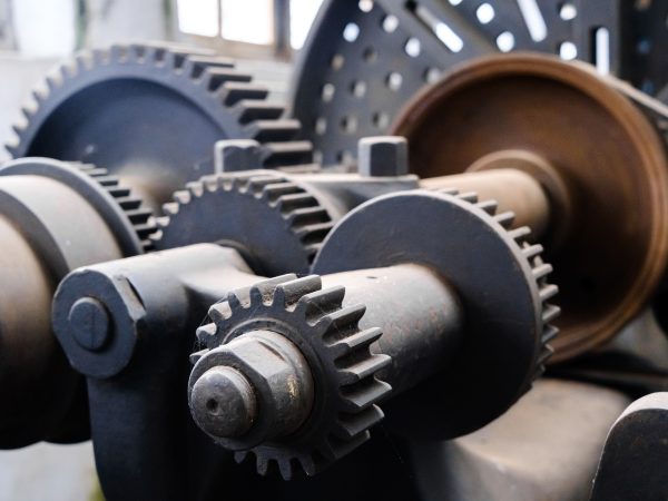 Old machinery from the 19th century to treat metal, exhibited in a museum.