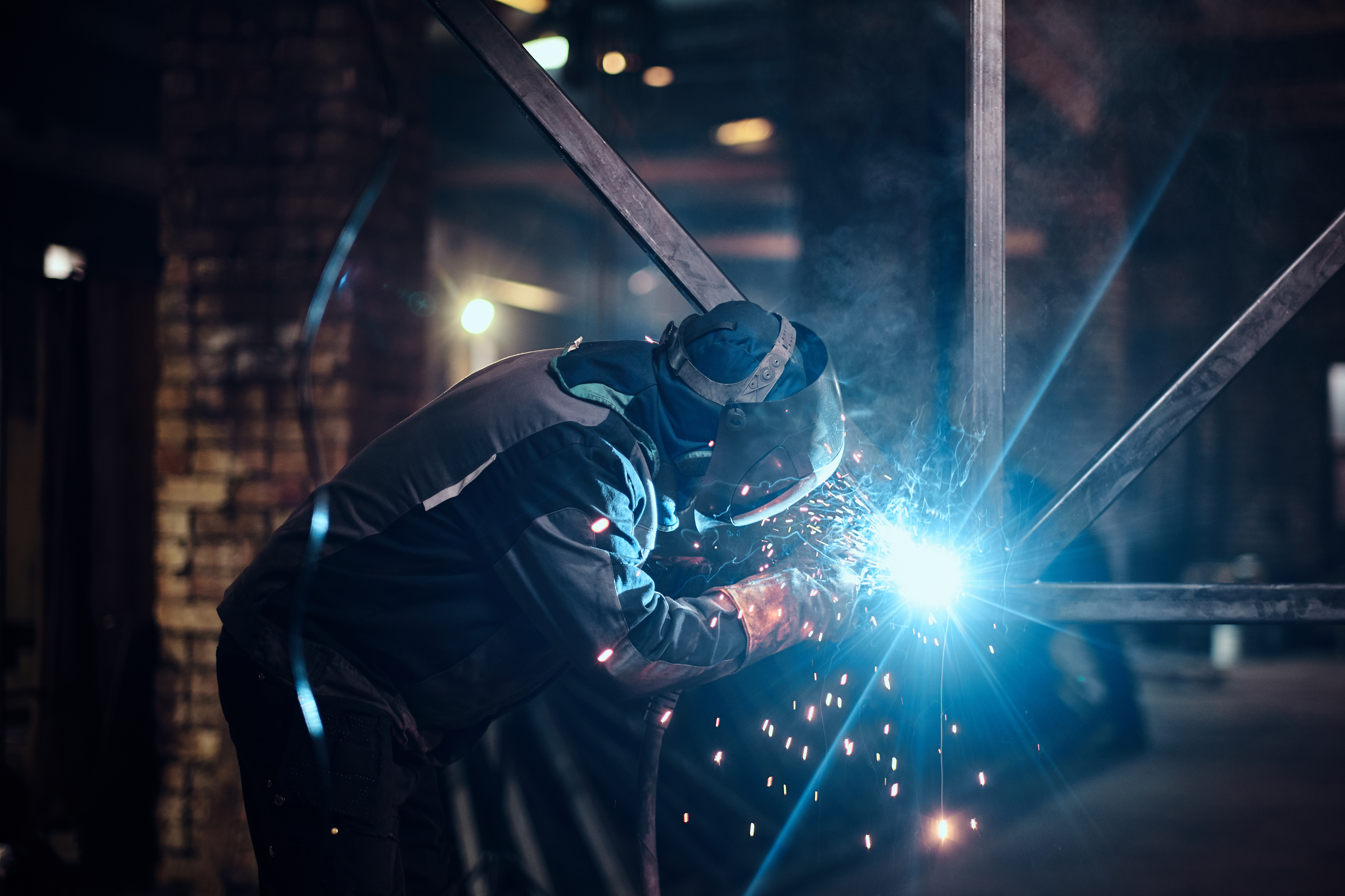 Man is working at the busy metal factory Man is working at the busy metal factory